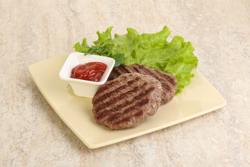 Grilled beef burger cutlet with sauce