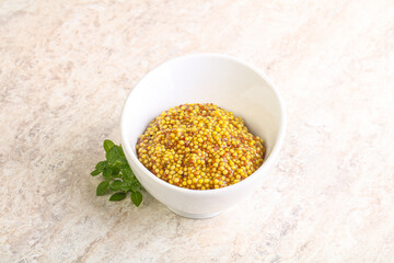 Grain mustard sauce in the bowl