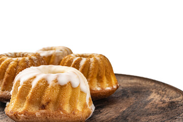 muffins in powdered sugar on a wooden board on a white background