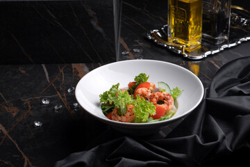 Salad with shrimp and oil with balsamic vinegar