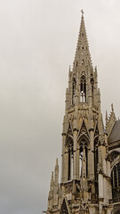 Fototapeta na wymiar Spire of the Roman catholic Saint Maclou church in gothic style Rouen, Frane