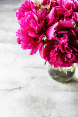 Bouquet of pink peonies in a vase. Background, copy space