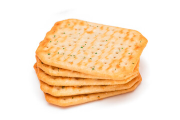 Stack of Crispy Salted Crackers with Greens - Isolated on White. Easy Snack - Isolation