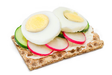 Whole Grain Crispbread with Fresh Cucumber, Egg, Cream Cheese and Radish - Isolated on White. Quick and Healthy Sandwiches. Crispbread with Tasty Filling. Healthy Dietary Snack - Isolation