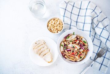 Warm backwheat pasta chicken vegetables salad with peanuts