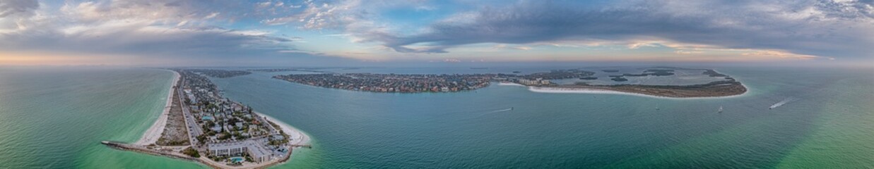 Drone panorama over Pass-a-Grille beach on Treasure Island and Pine Key area in St. Petersburg in Florida during sunset