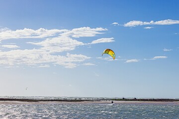 Picture of kitesurfers in stormy weather and sunshine in Florida