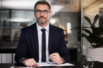 Become the hardest working person you know. Portrait of a mature businessman sitting at his desk.