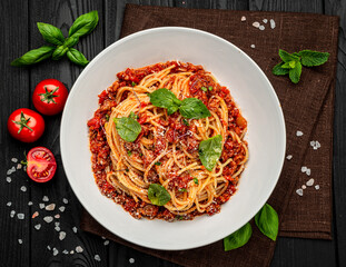 Traditional italian spaghetti bolognese on a dark background