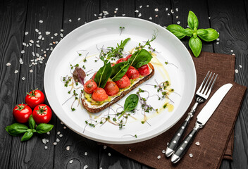 Delicious bruschetta with cream cheese, gluacomoli sauce and cherry tomatoes