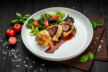 Beef Wellington, classic steak, classic recipe with green salad