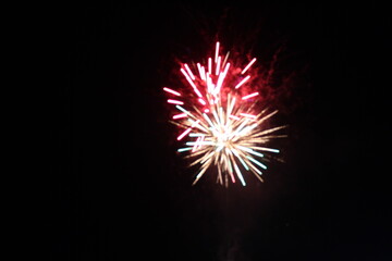 white red flashes rosette fireworks fireworks on a dark background holiday atmosphere celebrating...