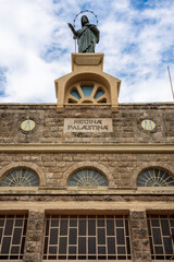 Fototapeta premium Dir Rafat - Regina Paestina Monastery, Israel. The front of the building with cloudy sky in the background.