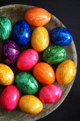 Fototapeta na wymiar Colorful Easter eggs on a wooden surface.