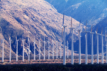 Fototapeta na wymiar mountain valley wind farm turbines windy canyon renewable energy electricity power turbines