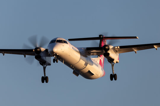 Adelaide, Australia - June 10, 2013: QantasLink (Sunstate airlines) Bombardier DHC-8-402 twin engine turboprop regional airliner on approach to land at Adelaide Airport.