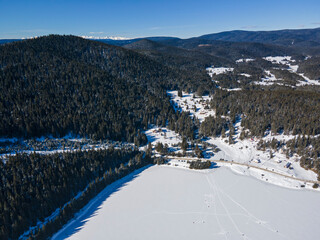 Aerial winter view of Beglika Reservoir covered with ice, Bulgaria