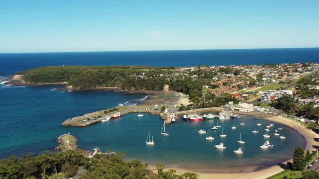 Stone breakwall guarding Ulladulla town harbour on Pacific South coast 4k.
