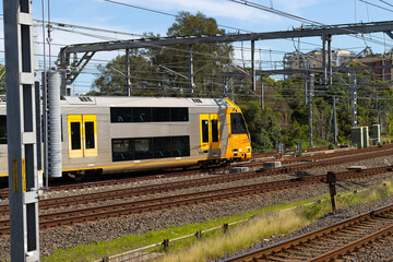 Commuter train approaching at a train station in Sydney NSW Australia blurred background 