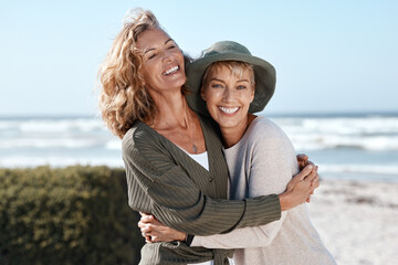 Best friends for life. Cropped shot of two attractive mature women hugging while standing on the...