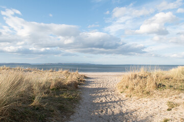 Fototapeta na wymiar Nairn Beach in Scotland. Beautiful scenic Scottish ocean scene. Sunny day. Beach resort near Inverness.