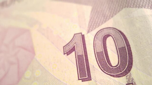 Red 10 turkish lira paper money banknote with monogram revolutionary statesman, founding father and first president Mustafa Kemal Ataturk. Monetary concept, official currency, TRY paper bill