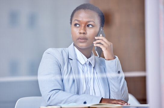 Im Glad You Called. Shot Of A Young Businesswoman Using Her Smartphone To Make A Phone Call.