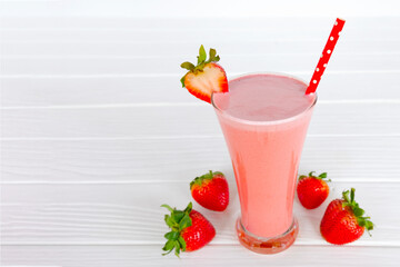 Strawberry yogurt fruit juice smoothie pink colorful fruit juice milkshake blend beverage healthy high protein the taste yummy In glass drink episode morning on white wood background.