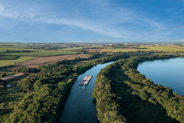 Fototapeta na wymiar grain transport barge going up the tiete river - tiete-parana waterway