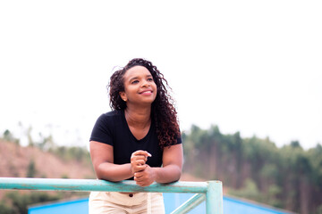 Portrait of a beautiful young black woman smiling. Young Brazilian or Latin American.