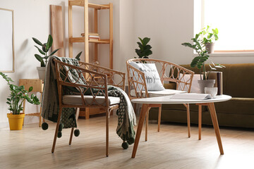Comfortable armchairs and table in modern living room