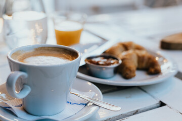 cup of coffee and croissant