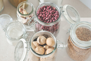 glass jars, Grocery stock, food and cereals. Zero Waste Kitchen. Plastic Free Pantry. No plastic. Eco family life, close up view.