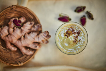 Super delicious, super nutritious. Shot of a freshly made ginger smoothie on a table.