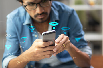 man using mobile phone and open internet wifi setting while sitting at home,  internet wifi concept