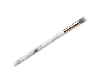 New makeup brush on white background