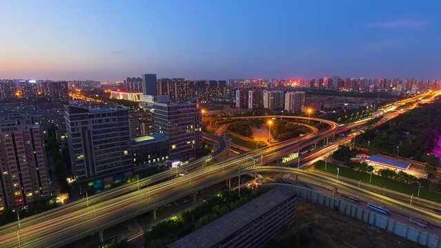 A panoramic view of a bustling city in China from day to night. Time-lapse