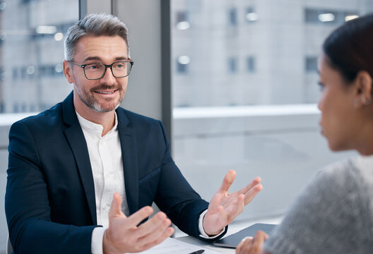 Im impressed. Shot of two businesspeople talking in an office.