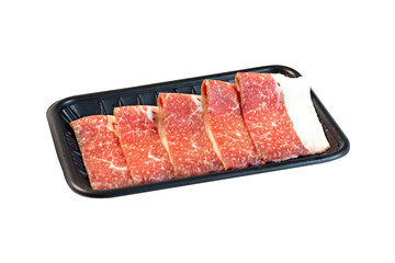 Side view of sliced ​​weeping tiger meat in a transparent plastic tray isolated on white background.
Buffet menu prepared for Sukiyaki and Shabu