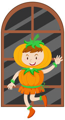 A girl wearing pumpkin costume for halloween