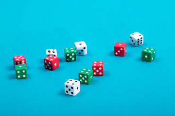 Multicolored Traditional dice on a colored background