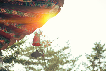 the bell under the eaves, the afternoon sun