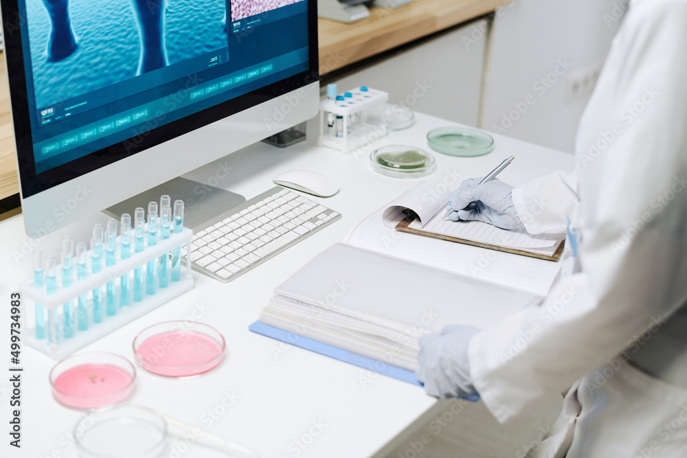 Aufkleber workplace of biotechnologist with flasks with blue liquid, petri dishes containing pink substance an