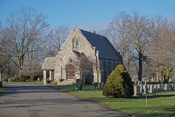 Fototapeta na wymiar A stone chapel along the banks of Lake Quannapowitt in Wakefield Massachusetts