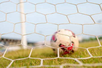 Close up of a soccer ball and net Football championship background