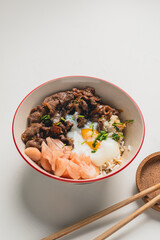 GYUDON Japanese beef & Rice,Japanese traditional dish Gyudon made from thinly sliced beef, onion, soy sauce and rice,food concept background