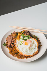 Thailand Food : Stir-fried beef and basil with fried egg on green plate Thai food concept.Thai street food.