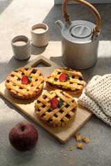 sweet apple pie with strawberry on the top of it