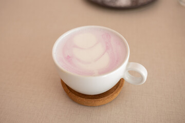 white of taro coffee on elegant vintage wooden table
