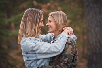 Fototapeta premium Two girl friends or lgnt couple in wood